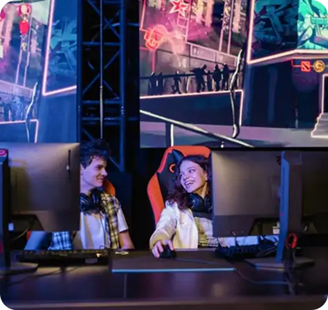 Modern gaming room with multiple gaming PCs, RGB lighting and professional gaming stations.